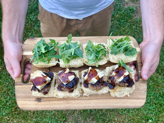 Blueberry Brie sliders on board outside